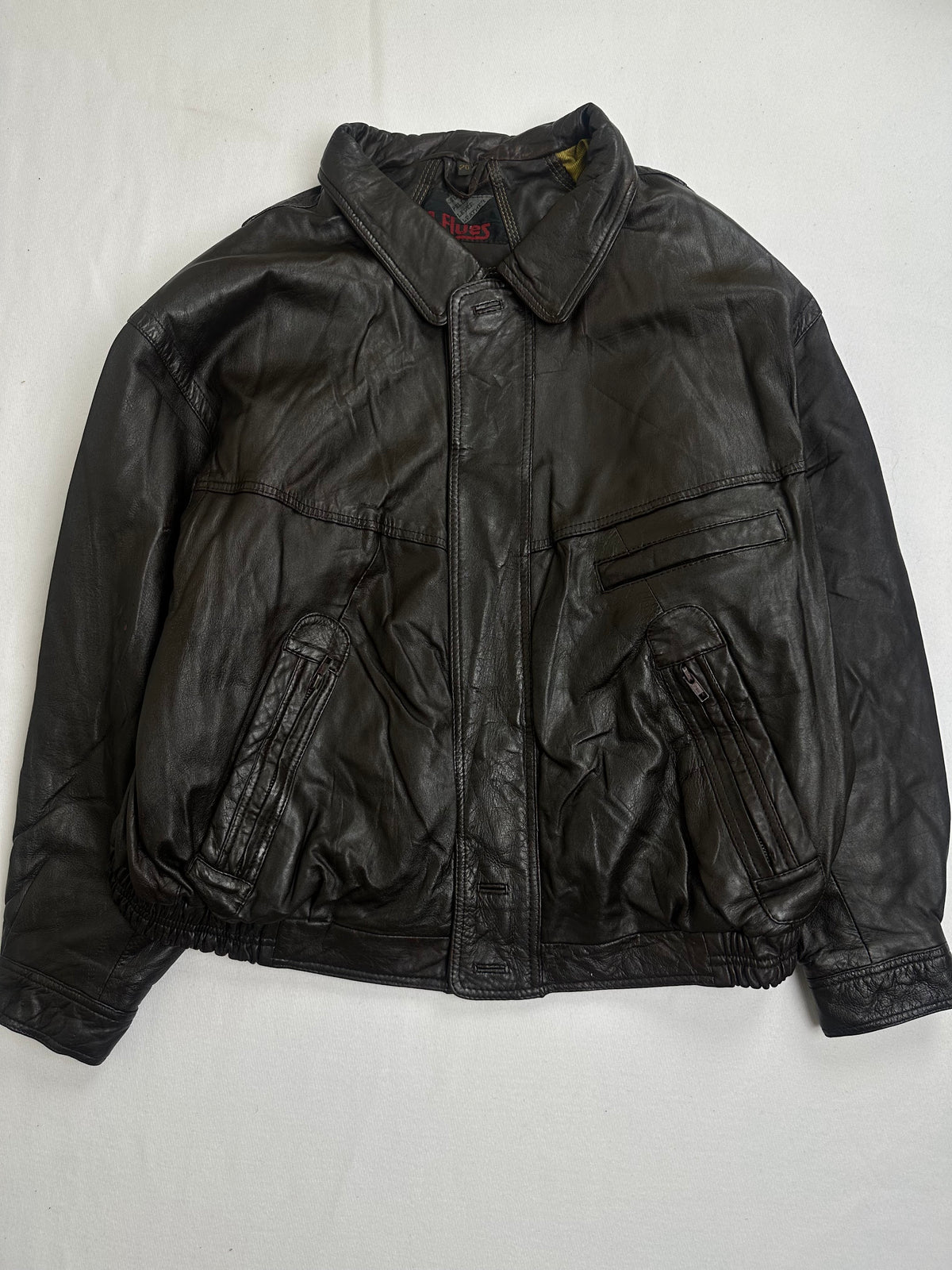 Back of the size L brown harrington laid flat