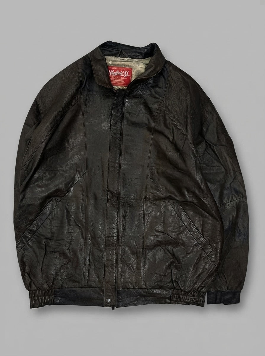 Brown leather harrington jacket, size M, shown flat from the front. Printed scenic lining.