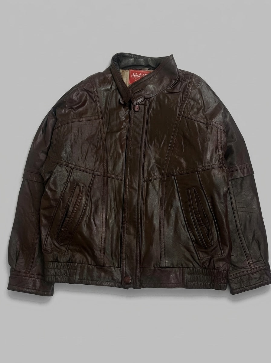 Brown leather vintage jacket, size L, shown flat from the front. Cream fleece lining.