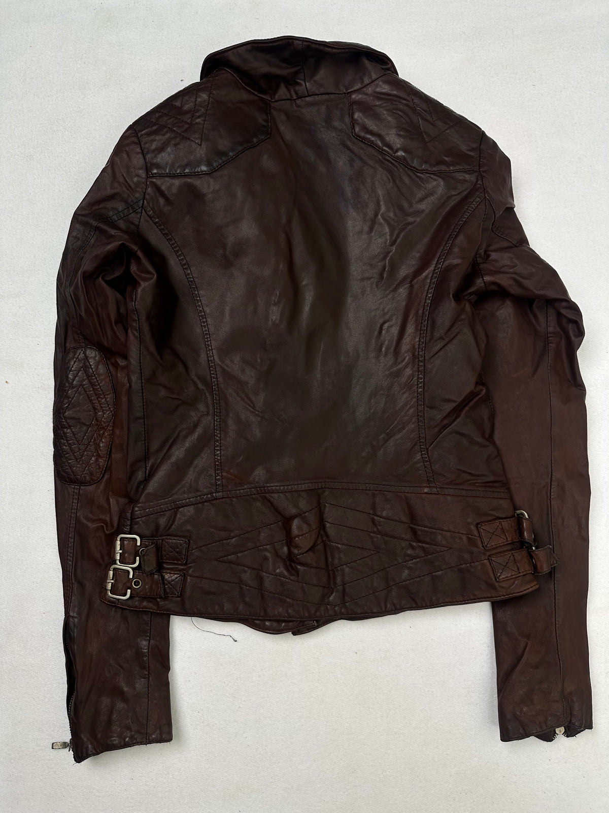 Back of the size S burgundy leather biker jacket, laid flat