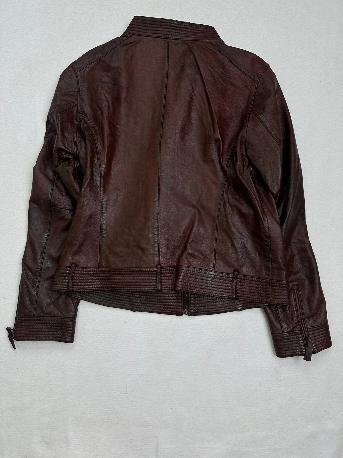 Back of the size S burgundy leather cafe racer jacket, laid flat