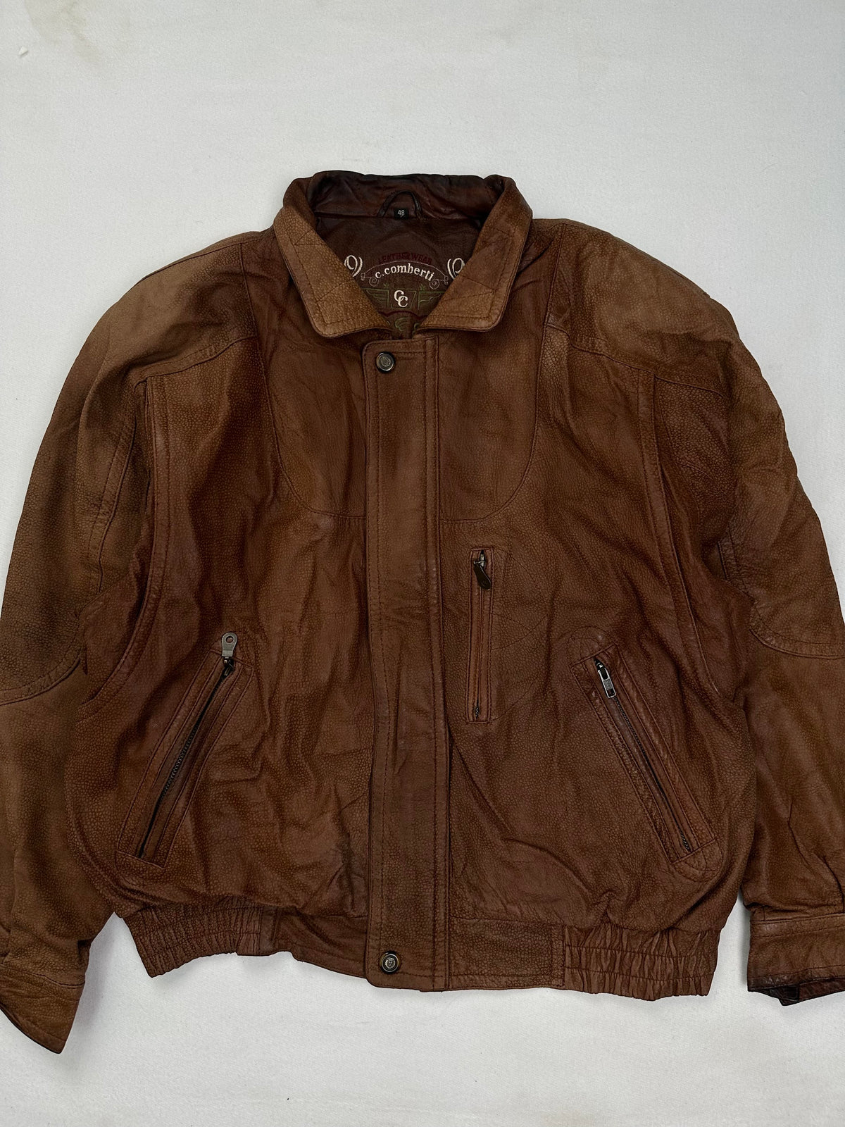 Back of the size XL brown harrington jacket laid flat