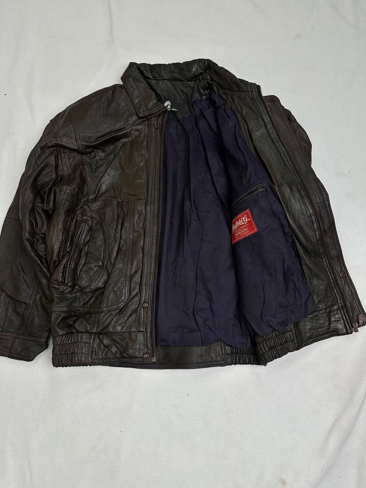 Dark navy lightweight woven lining inside the jacket