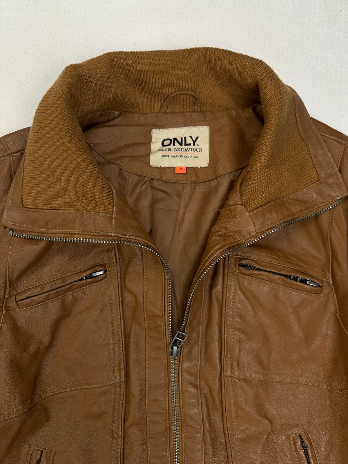 Brown lining shown with the bomber held open at the front