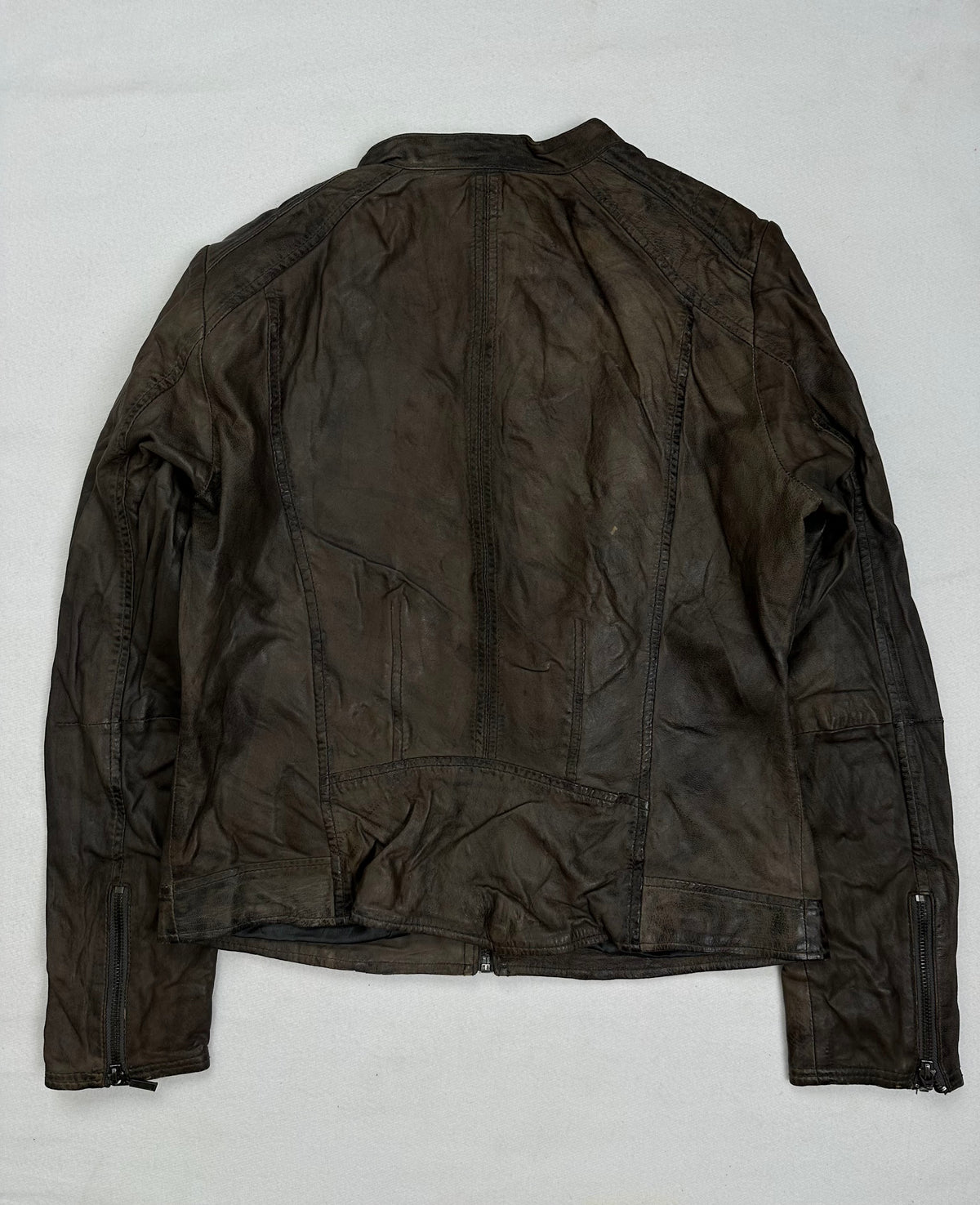 Back of the size S brown leather cafe racer jacket, laid flat