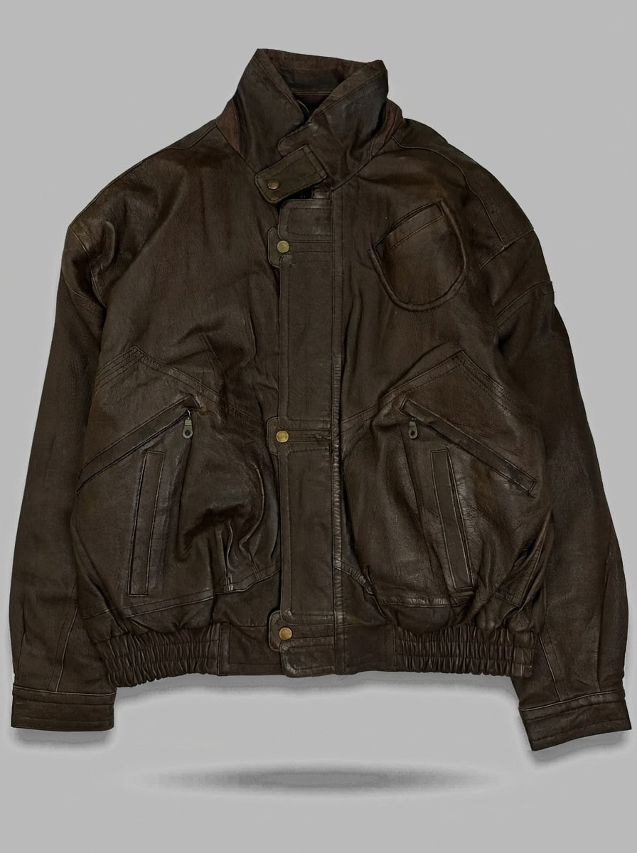 Brown leather flight jacket, size M, shown flat from the front. Rounded patch pocket.