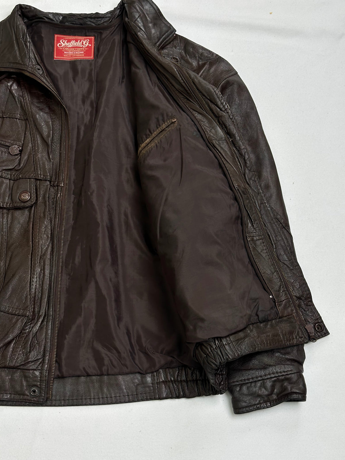 Slanted zip welt set into the chest panel above a snap flap pocket