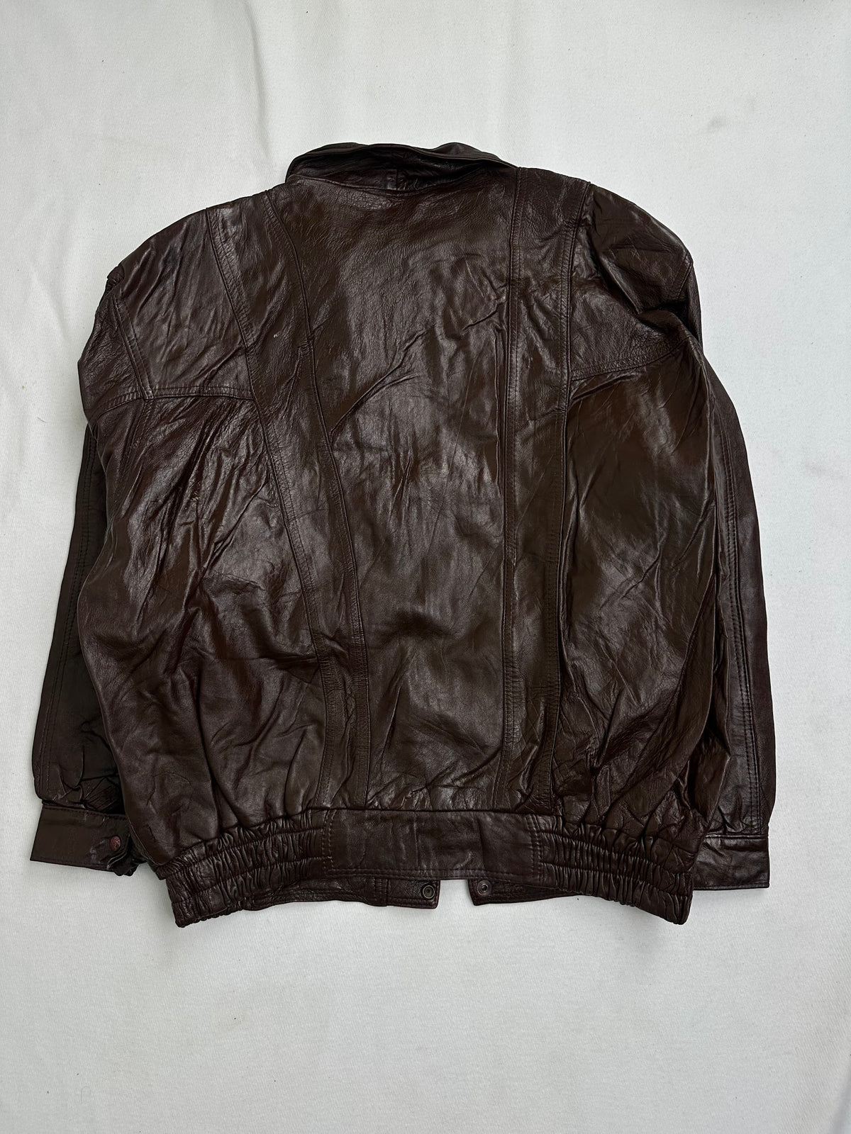 Back panel and sleeve heads showing heavy set-in creasing