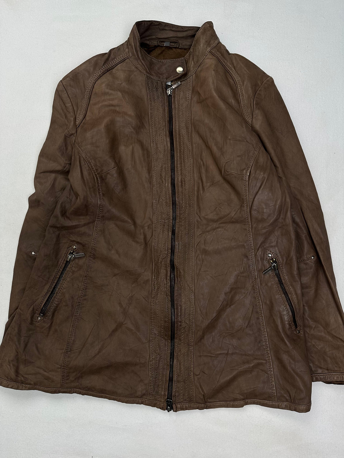 Back of the size XL brown cafe racer jacket laid flat