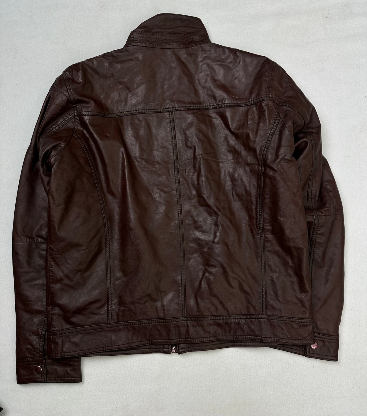 Back of the size L burgundy leather cafe racer jacket, laid flat