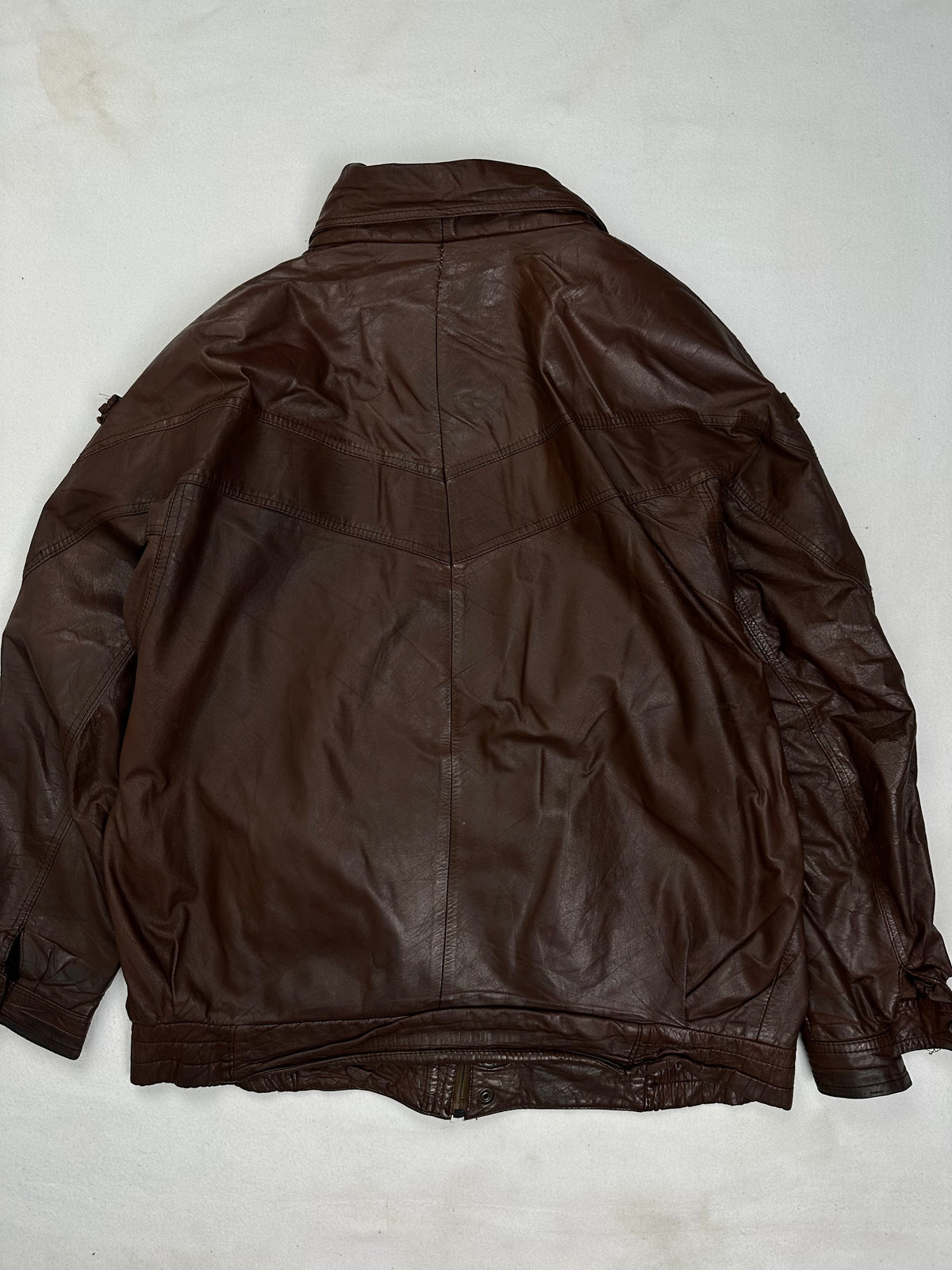 Back of the size XL burgundy leather vintage jacket, laid flat