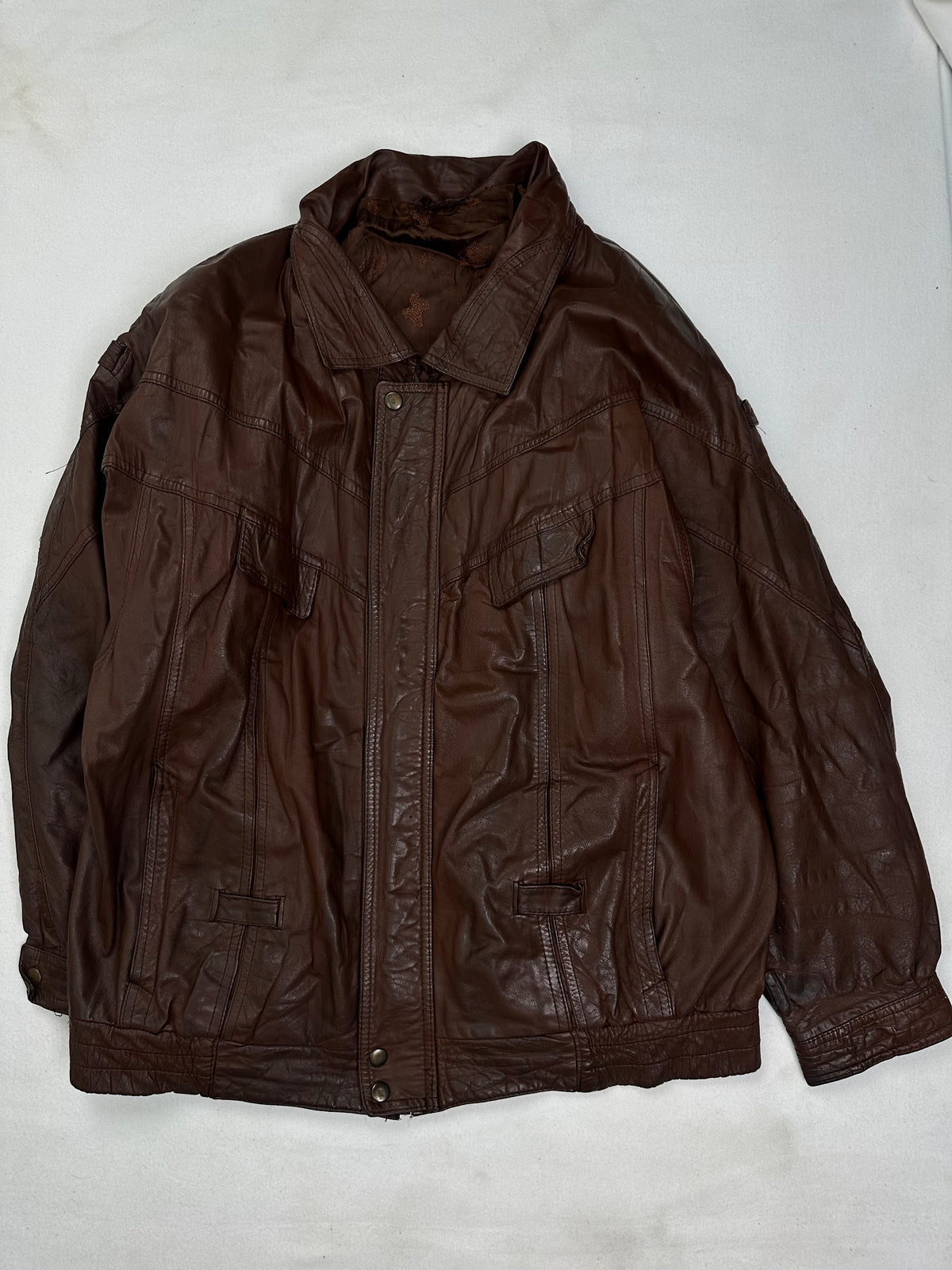 Front of the size XL burgundy leather vintage jacket, laid flat and unedited