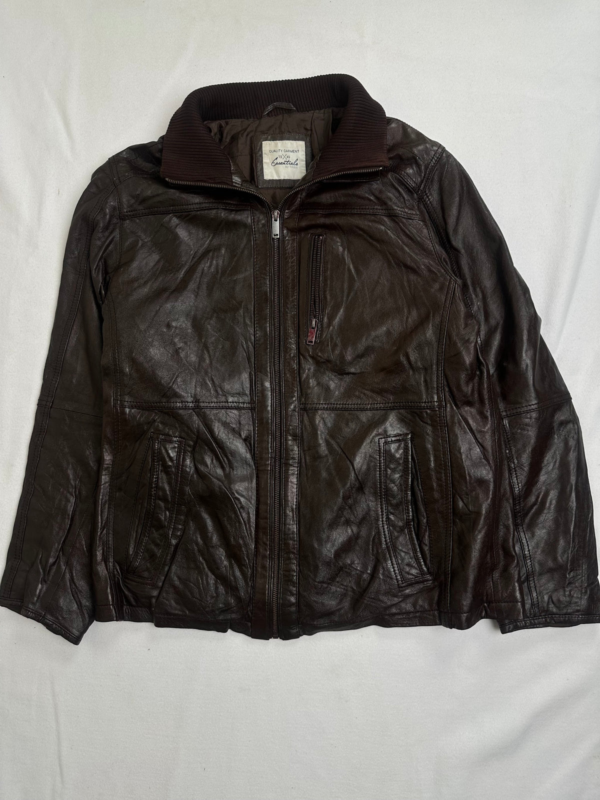 Back of the size L brown vintage jacket laid flat