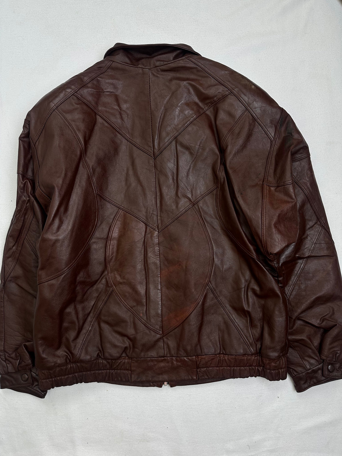 Back of the size L burgundy leather vintage jacket, laid flat