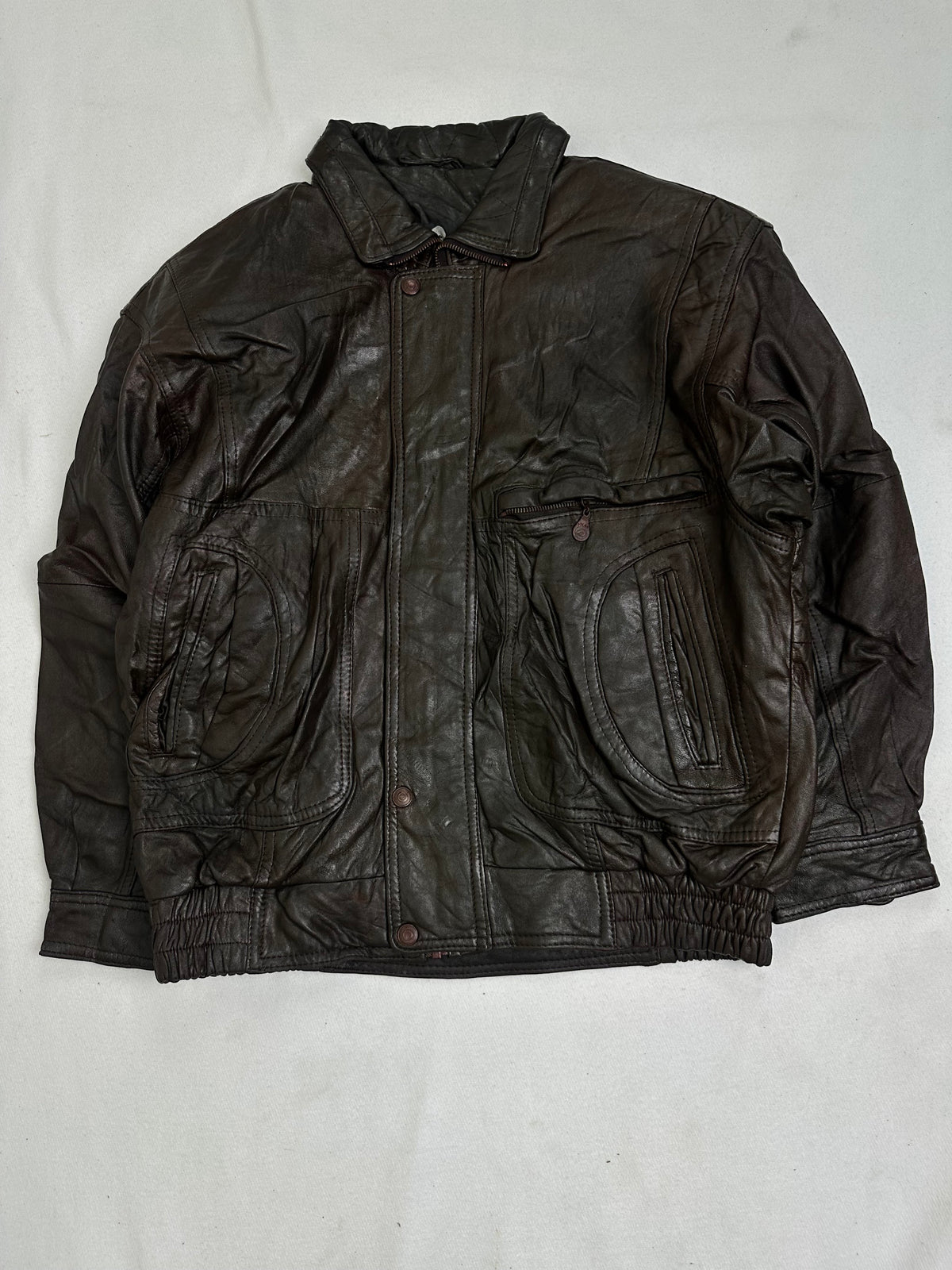Front of the jacket showing the zip pockets set into large teardrop leather yokes