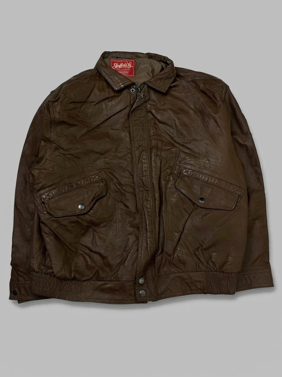 Brown leather flight jacket, size M, shown flat from the front. Snap Flap Hip Pockets.