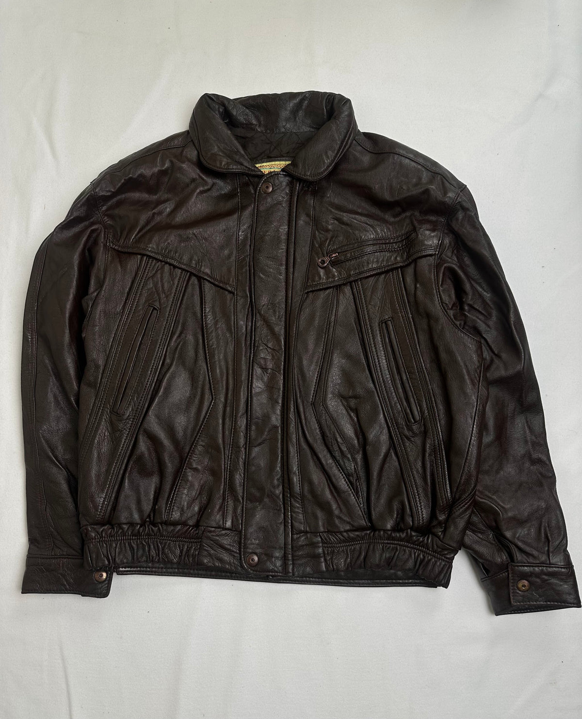Back of the size XL brown harrington jacket laid flat