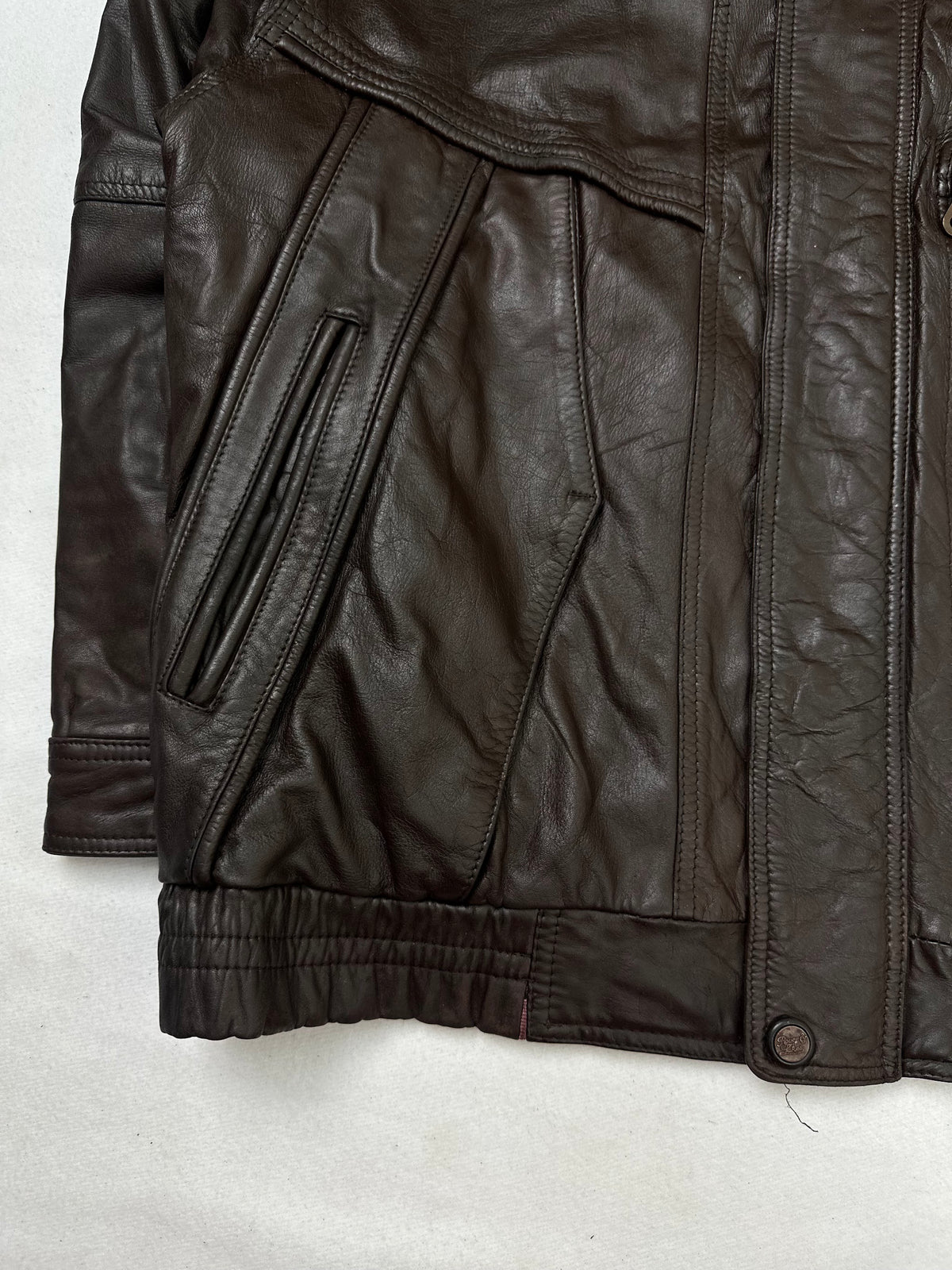 Close detail of the pockets and cuff on the size XL brown leather flight jacket
