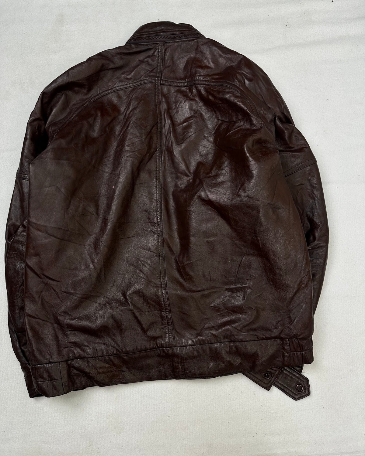 Back of the size L burgundy leather biker jacket, laid flat