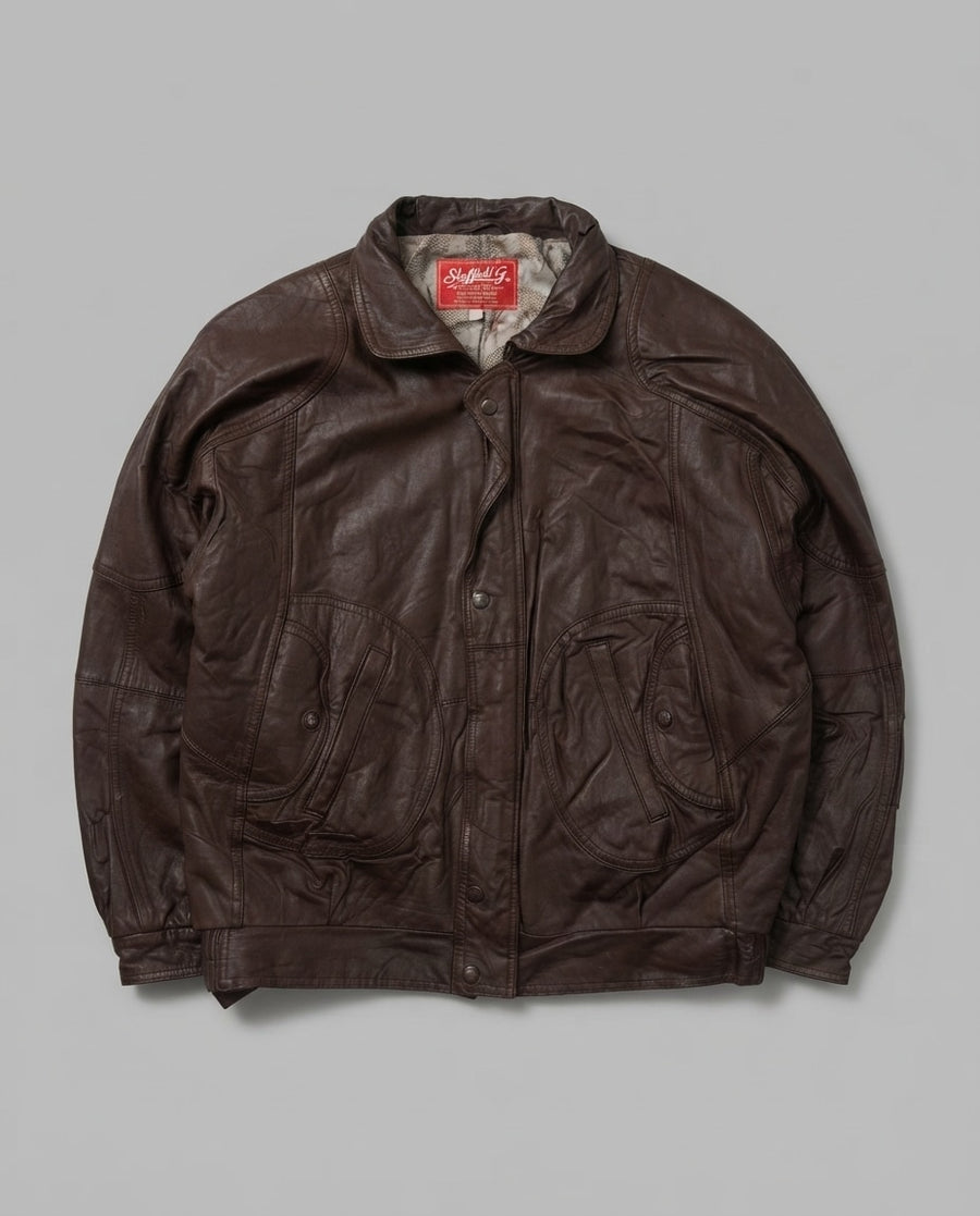 Brown leather harrington jacket, size L, shown flat from the front. Grey printed lining.