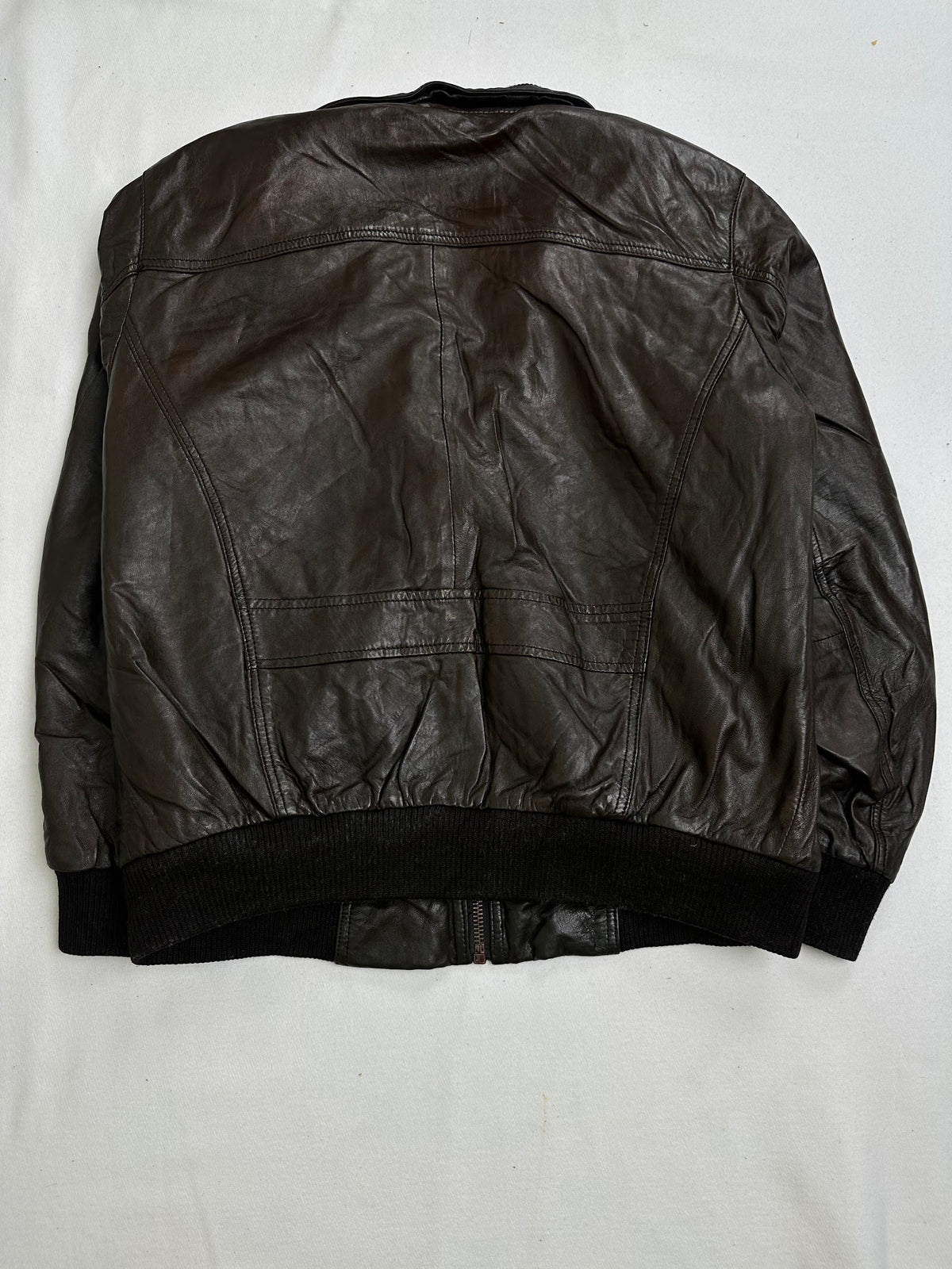 Ribbed knit collar standing over the centre zip