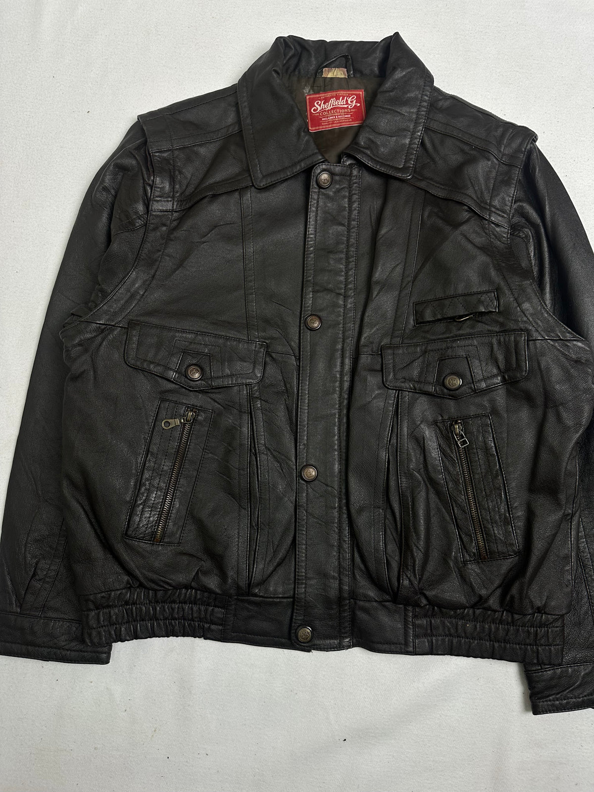 Back of the size L brown trucker jacket laid flat