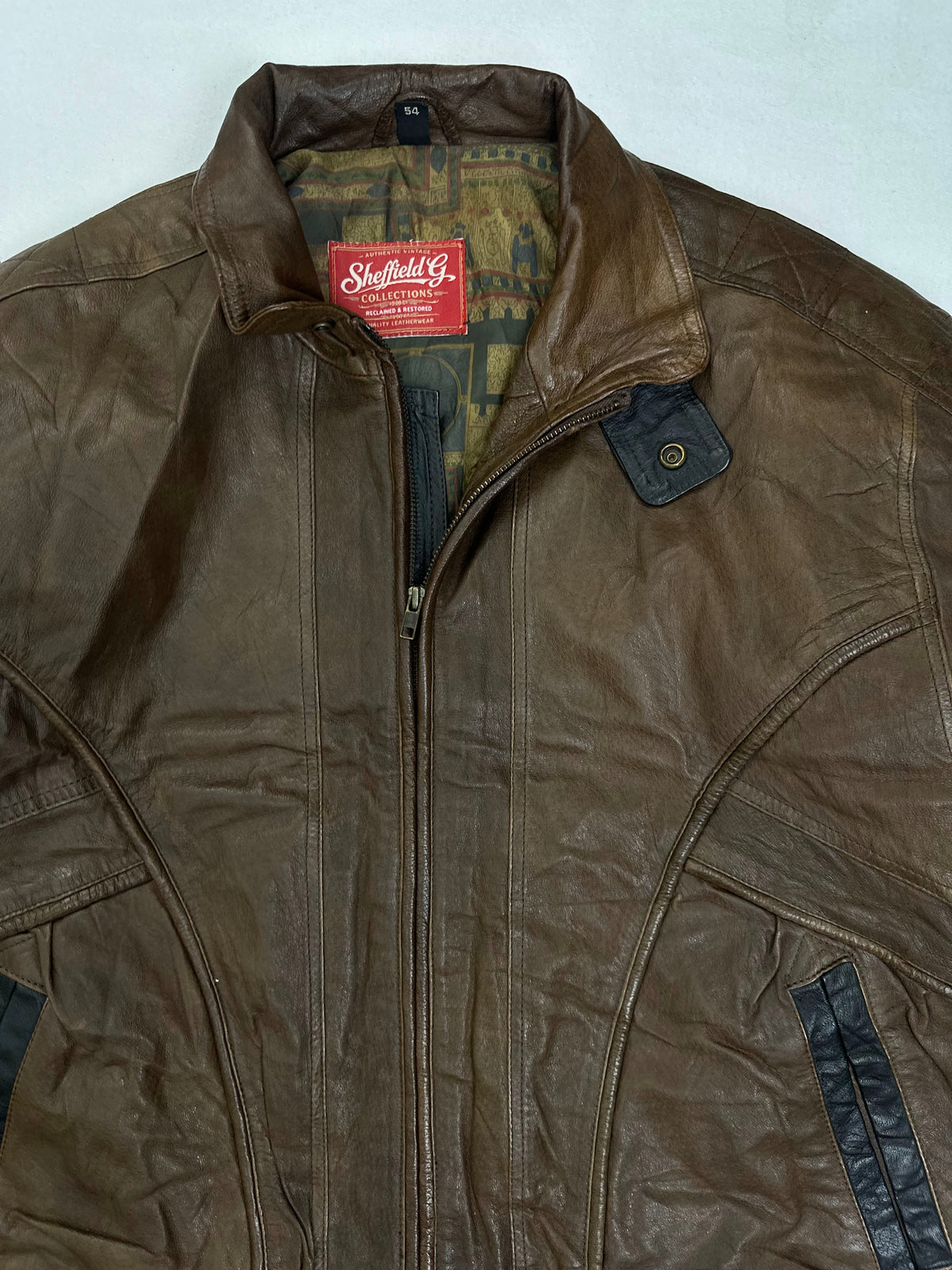 Slanted hand pocket on dark zip tape beside the shirred waist