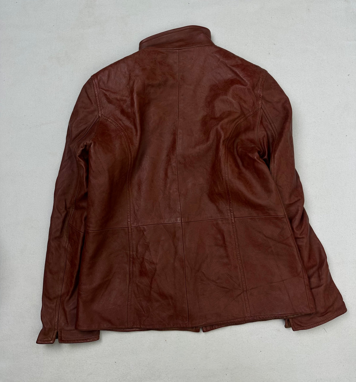Back of the size S burgundy leather cafe racer jacket, laid flat
