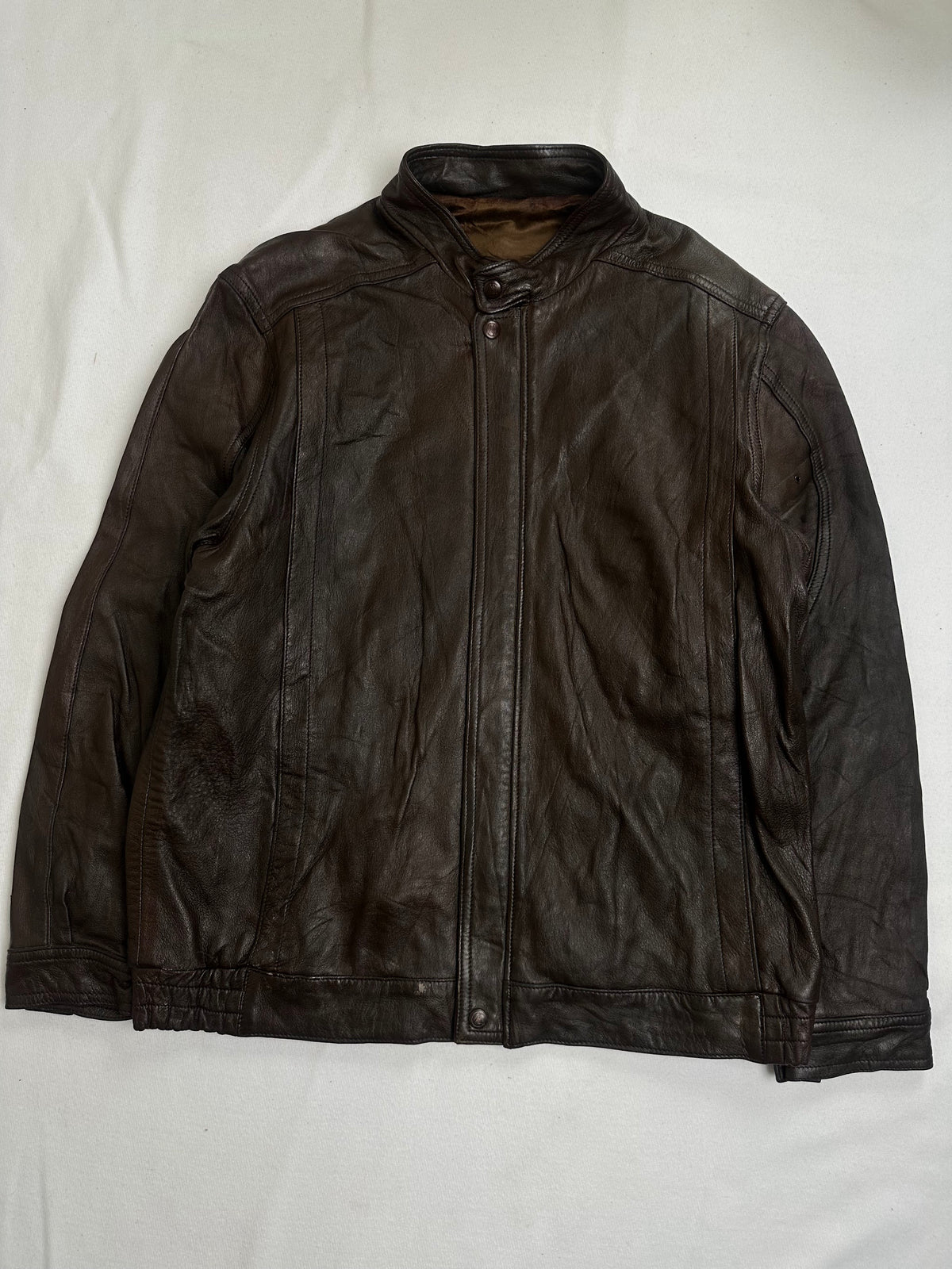 Back of the size L brown cafe racer jacket laid flat