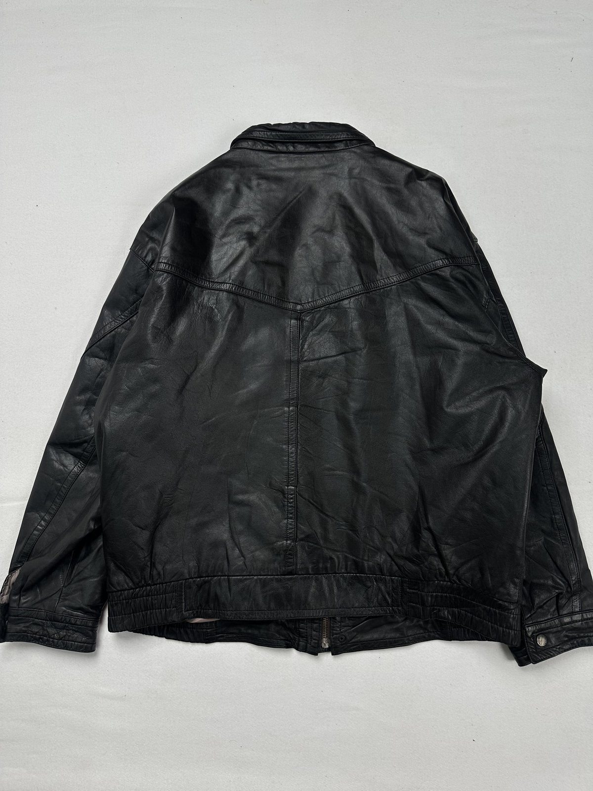 Back of the XXL black field jacket laid flat with a curved yoke seam