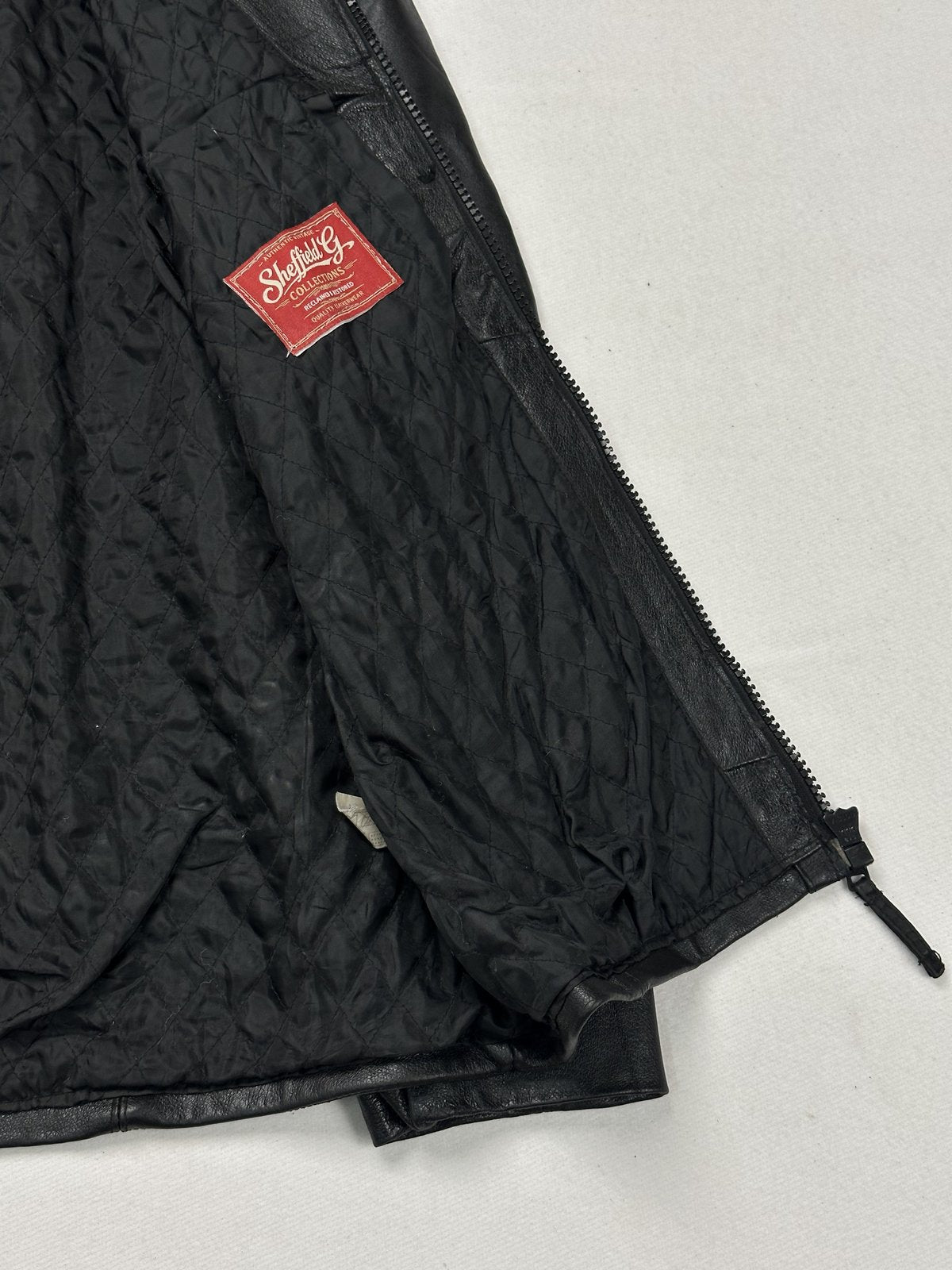 The size L black cafe racer, 27 inches long through the body
