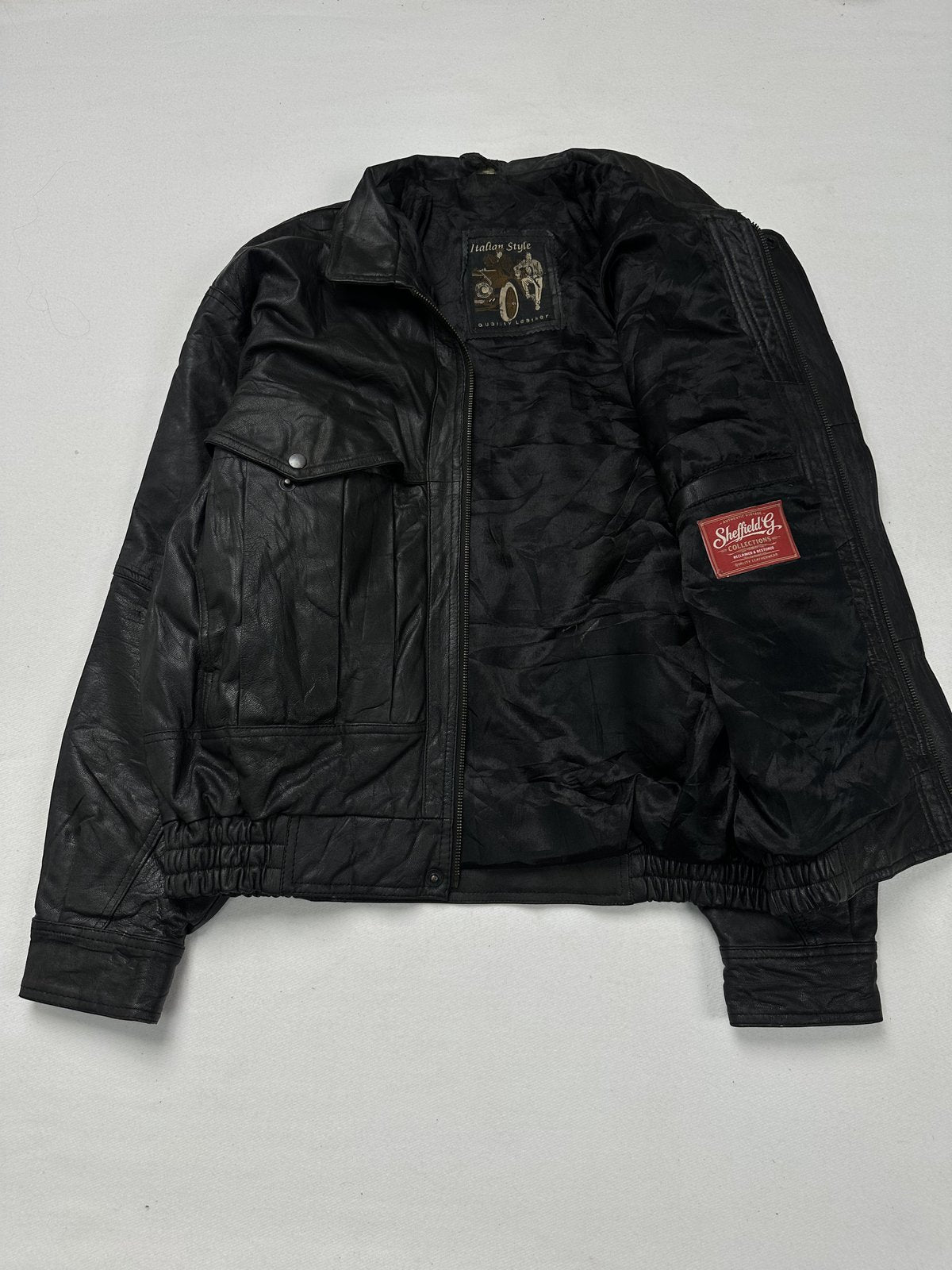 Broad black leather jacket in size XXL with a 22 inch shoulder