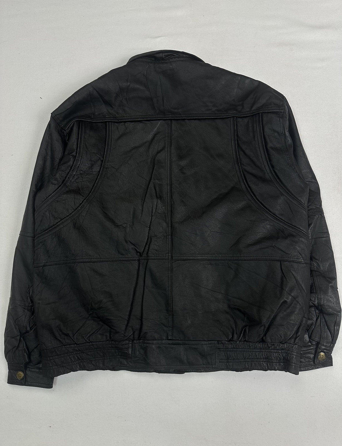 Black leather field jacket in size XXL with six pockets across the front