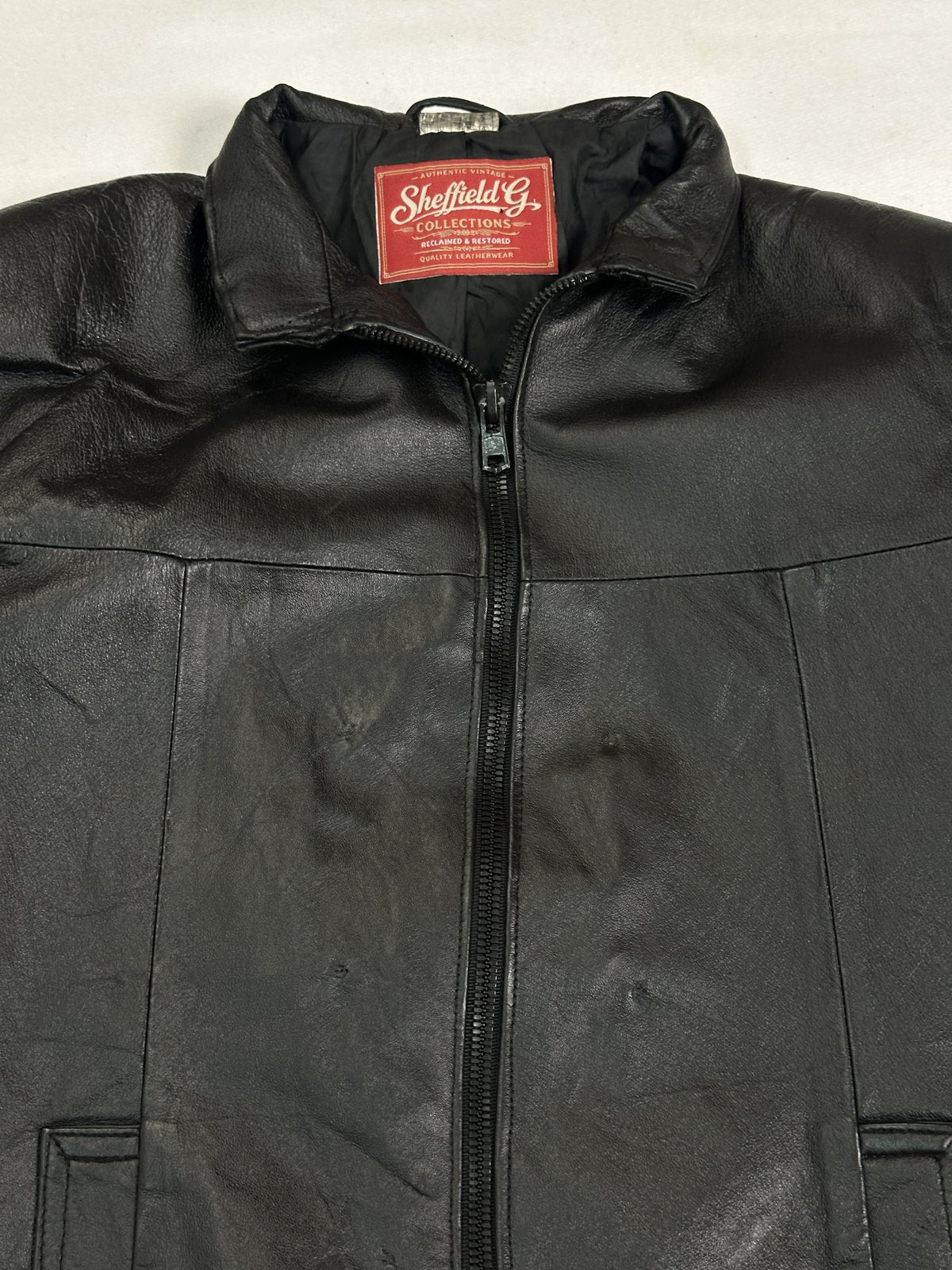 Black real leather cafe racer with a 24 inch sleeve, size L