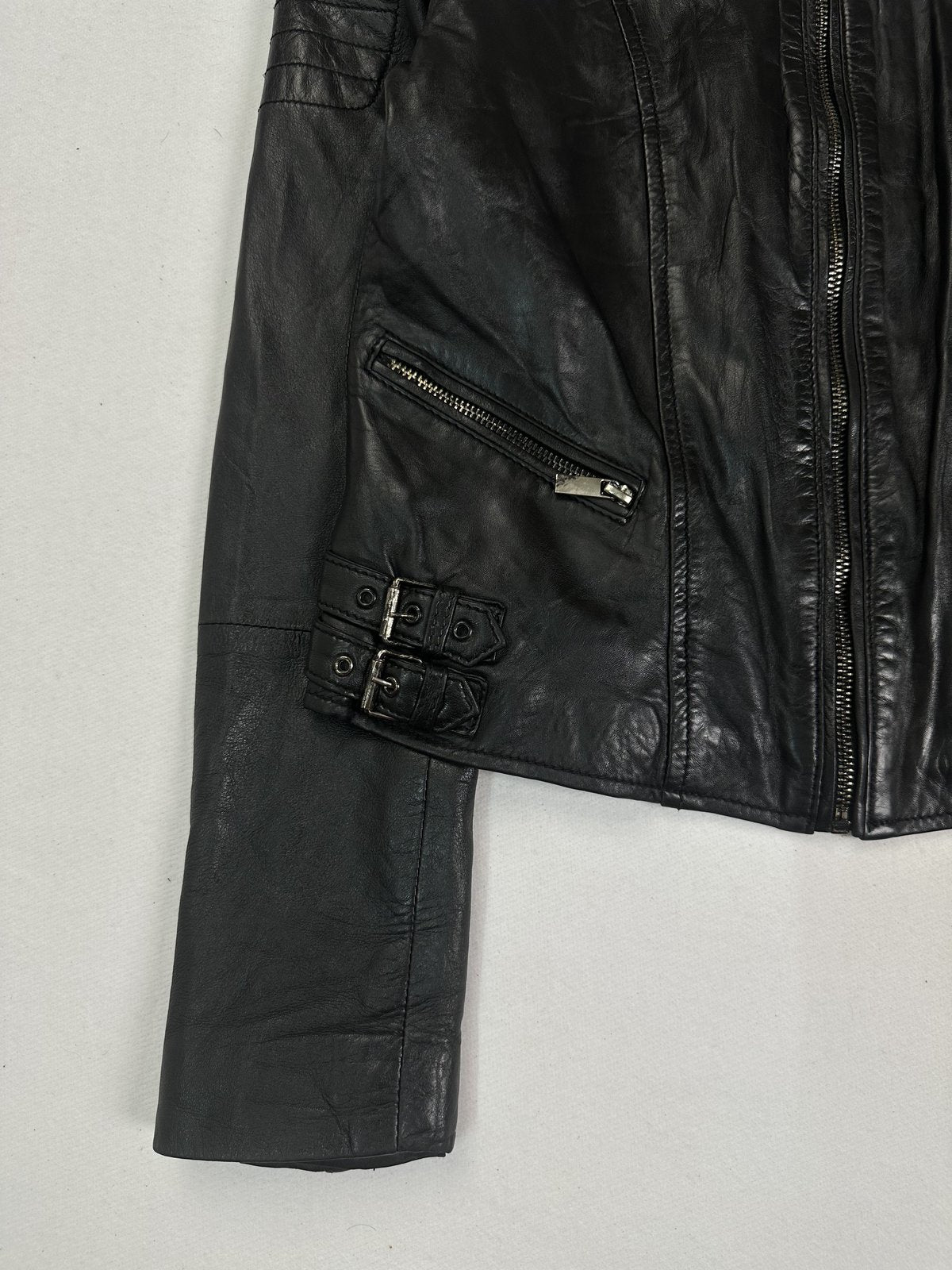 Clean unbroken lines across the front of the size S black cafe racer