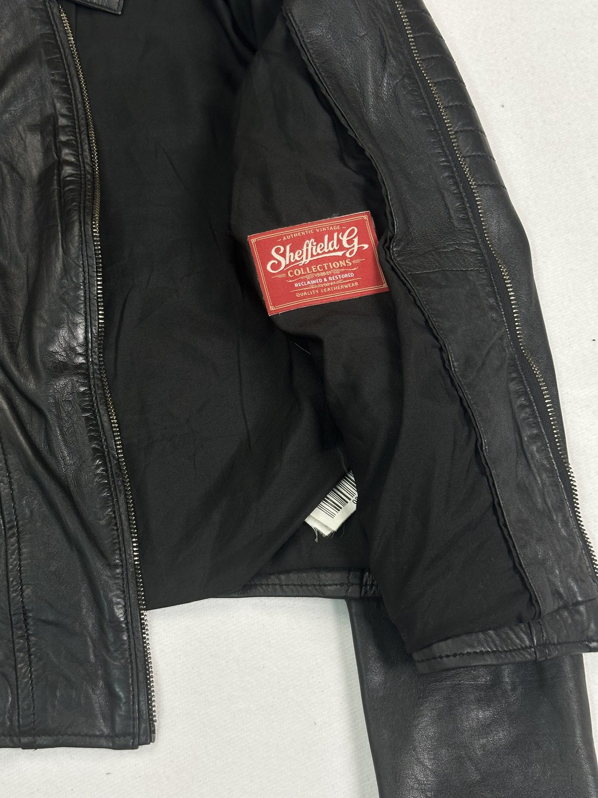 Narrow shouldered black cafe racer jacket in real leather, size S