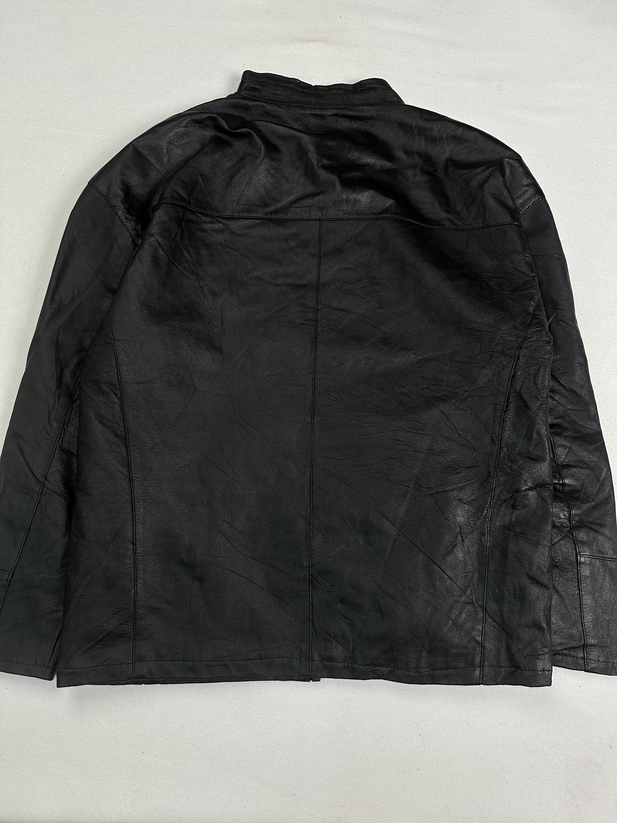 Back of the L black cafe racer laid flat with an unbroken leather panel