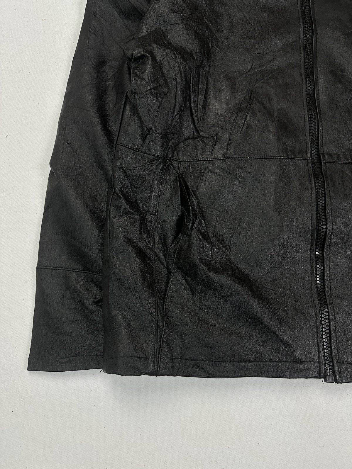 Lower front detail where the horizontal waist seam meets the straight hem