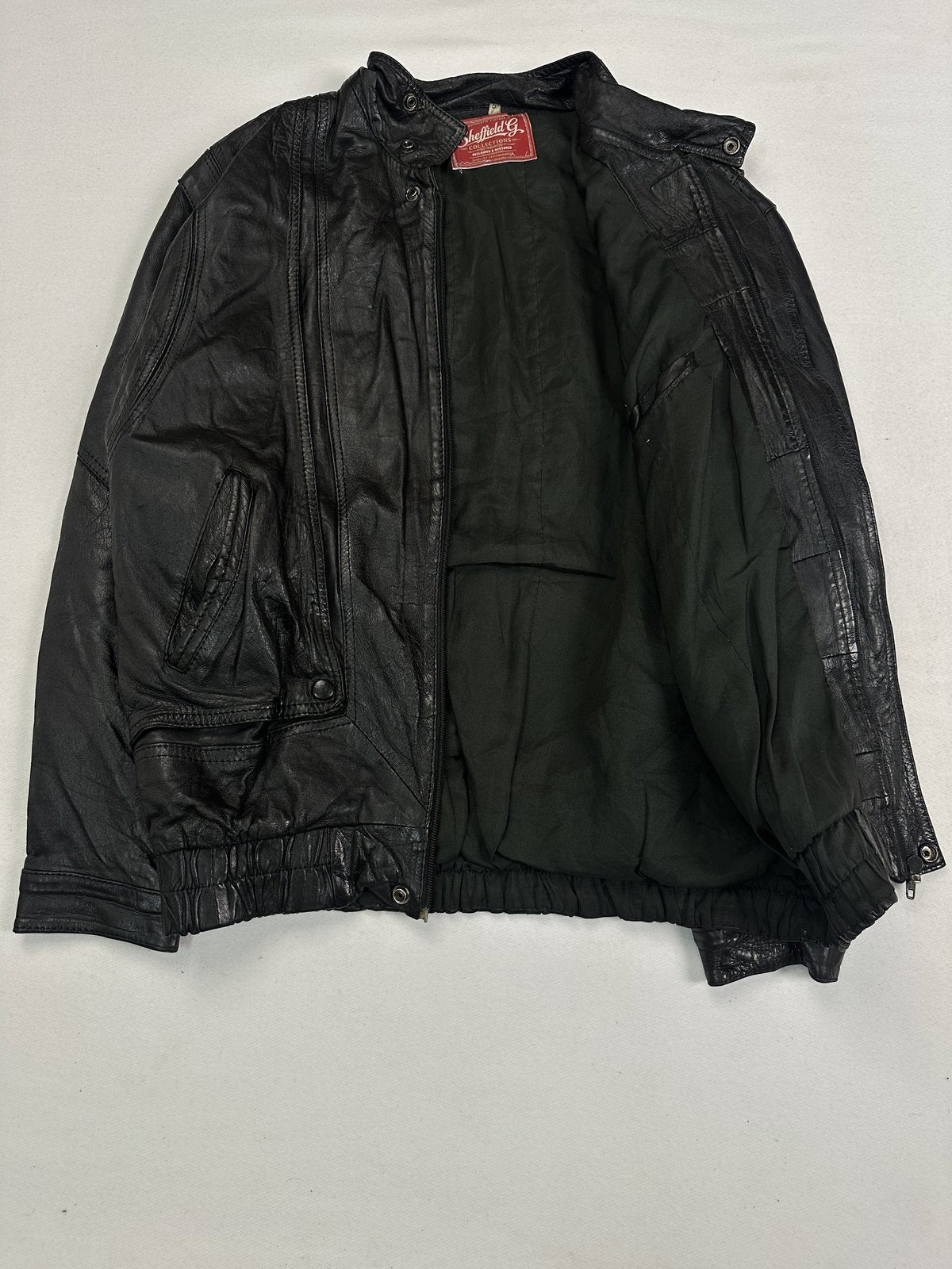 Black real leather blouson with a 24 inch sleeve, size XL