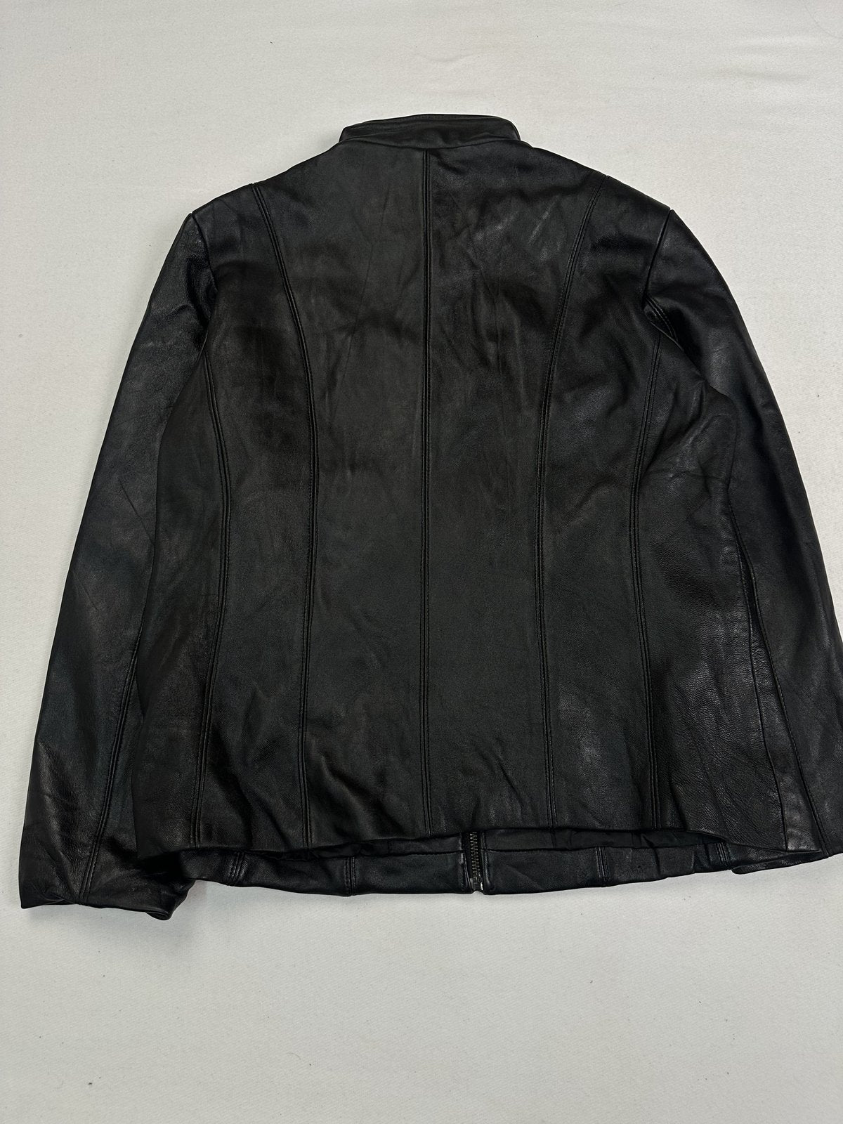 Back of the size M cafe racer laid flat, showing the panelled leather and side seams