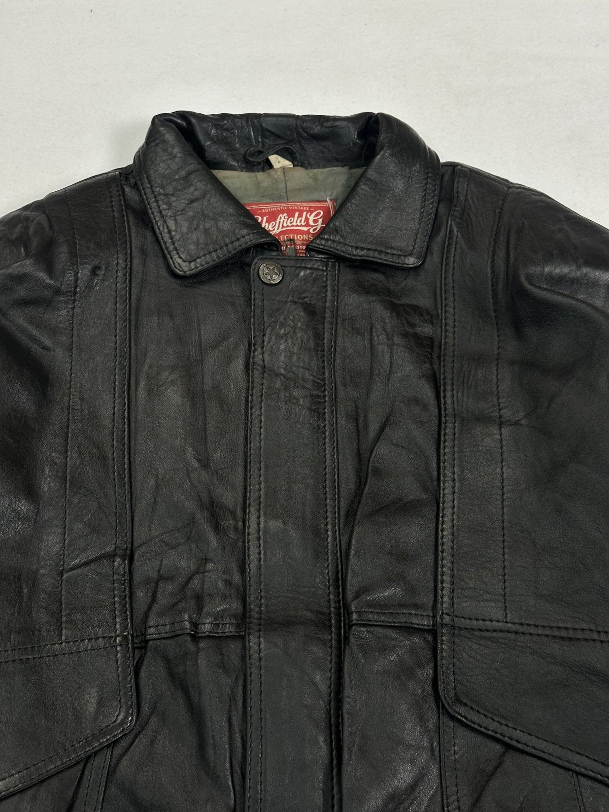 The size XL black jacket, 28 inches long through the body