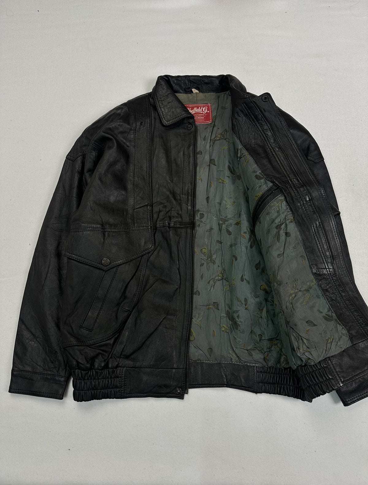 Black real leather jacket with a 23 inch sleeve, size XL