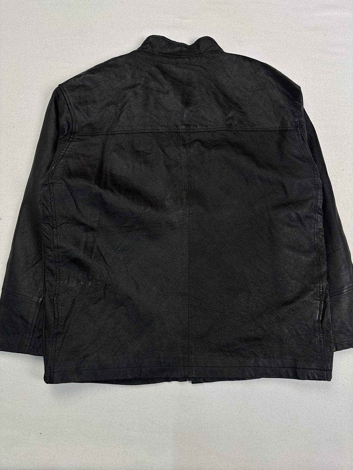 Back of the size L black Harrington laid flat showing the plain panel and yoke seam