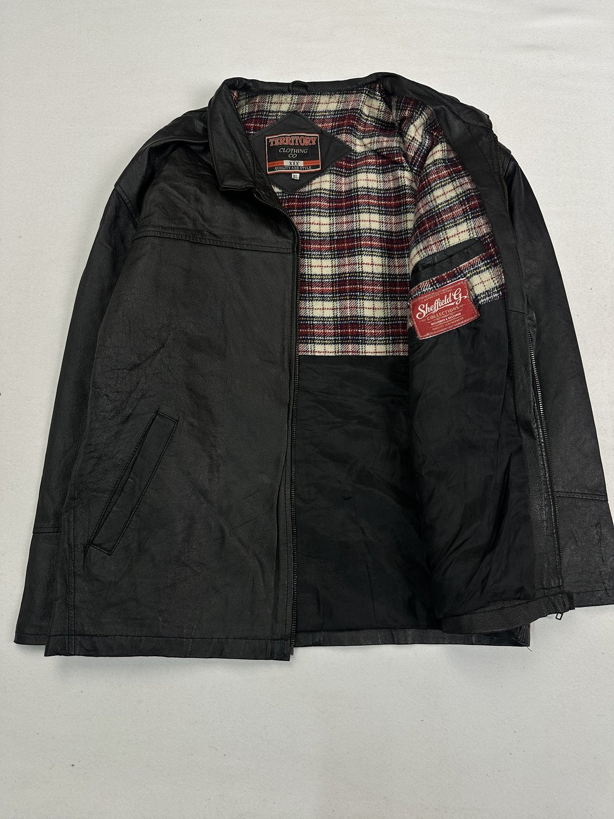 Harrington held open to show the plaid check lining running the full length of the front