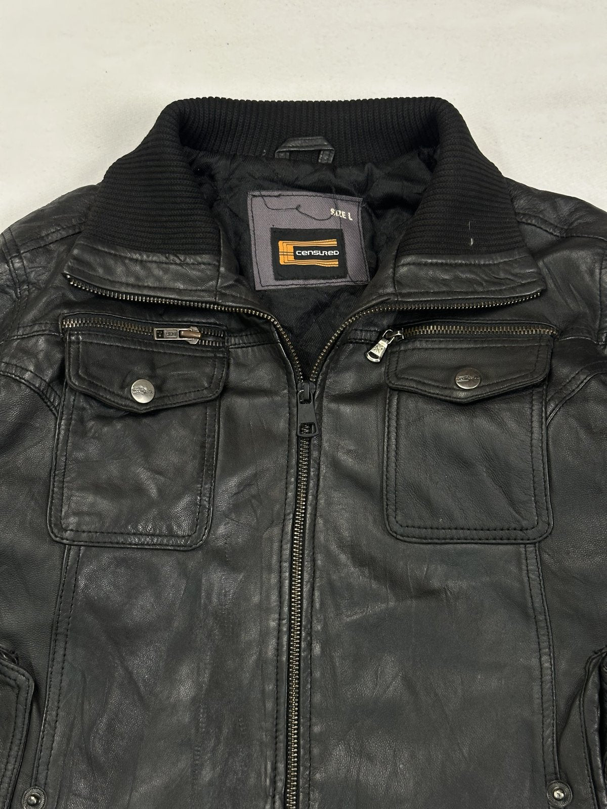 Black leather bomber jacket in very good condition, shown in size M