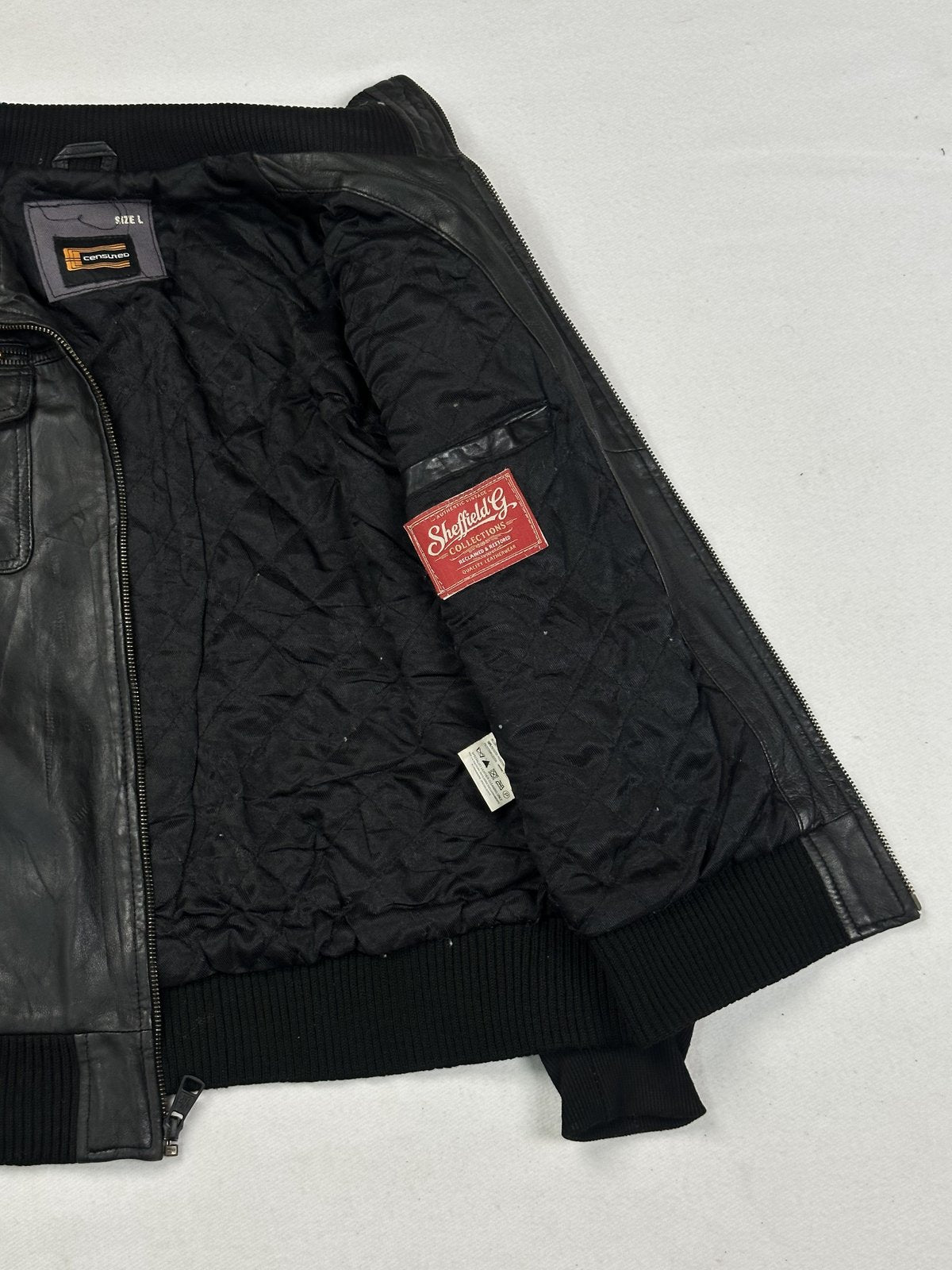 The black bomber jacket in size M, 24 inches long through the body