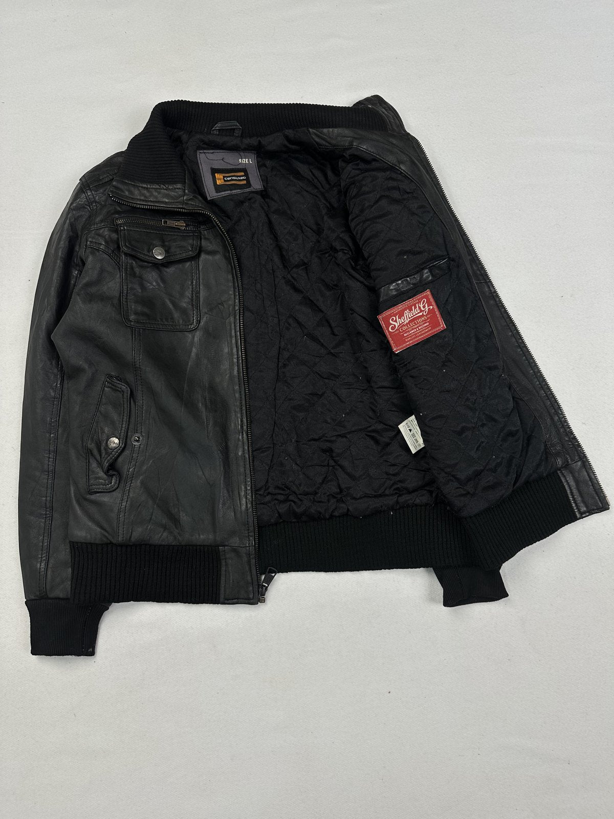 Chest zips set into the black leather of this size M bomber jacket
