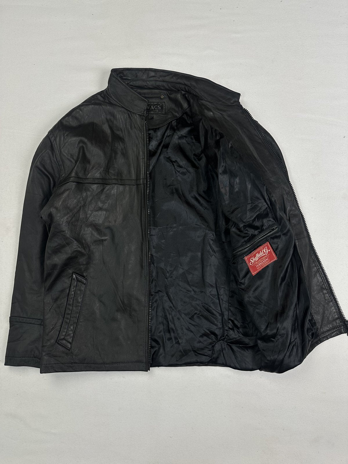 Black real leather cafe racer with a 23 inch sleeve, size L
