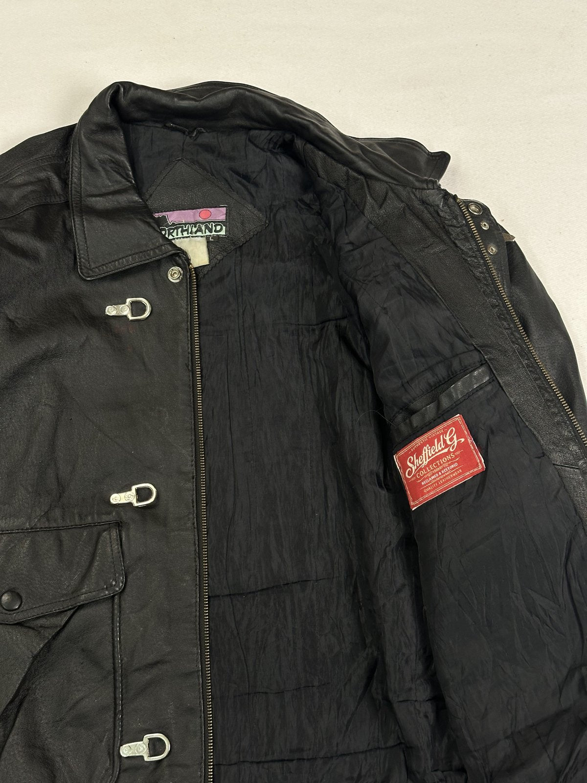 Roomy black leather jacket in size XXL with a 25 inch waist