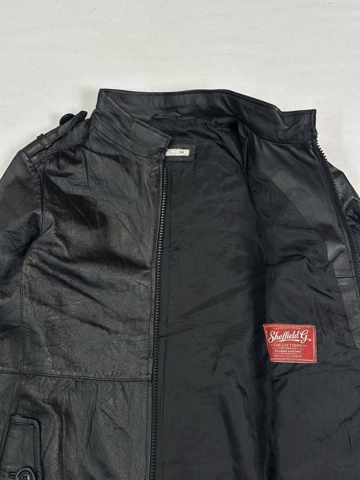 Black real leather jacket with a long 26 inch sleeve, size M